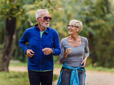 Retired couple jogging in a park