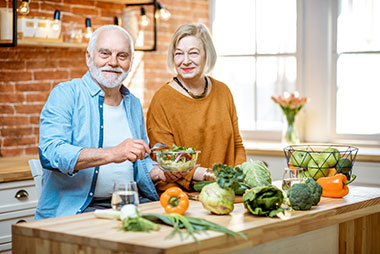 Retired couple making healthy meal