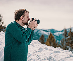 Man photographing in snow