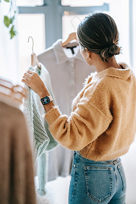 woman shopping looking at clothing