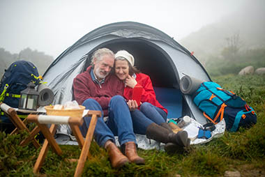 retirees enjoying tent camping