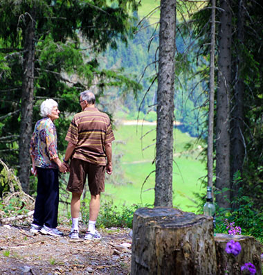 seniors hiking along a forest trail