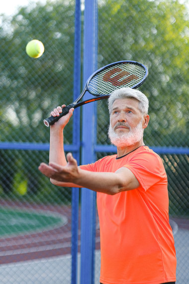 Retiree playing tennis
