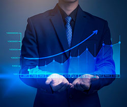 Man in suit holding digital graph