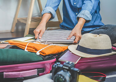 woman packing suitcase