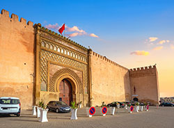 Old walls and gate Bab El-Mansour at El Hedim square in Meknes. Morocco